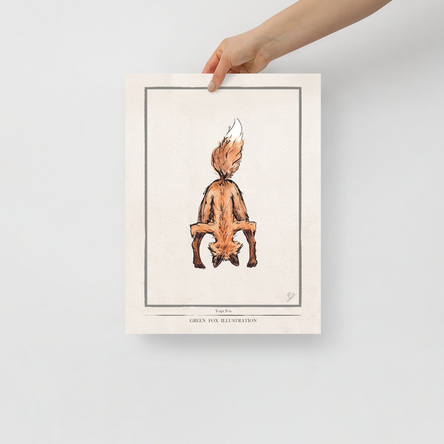 owl poster hanging on a wall in a room with plants