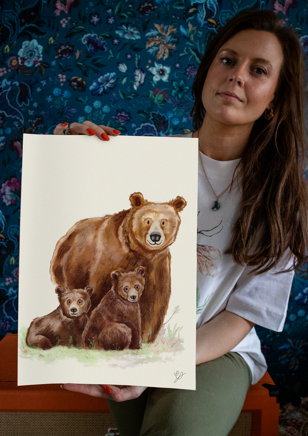 Madeleine of Green Fox Illustration painting ink and watercolour artwork in her studio