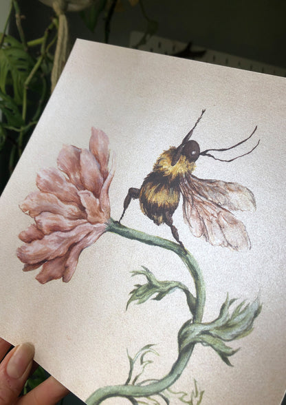 a print of a watercolour yoga bee illustration on shimmer paper